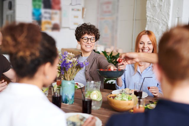 adult friends happy at dinner party