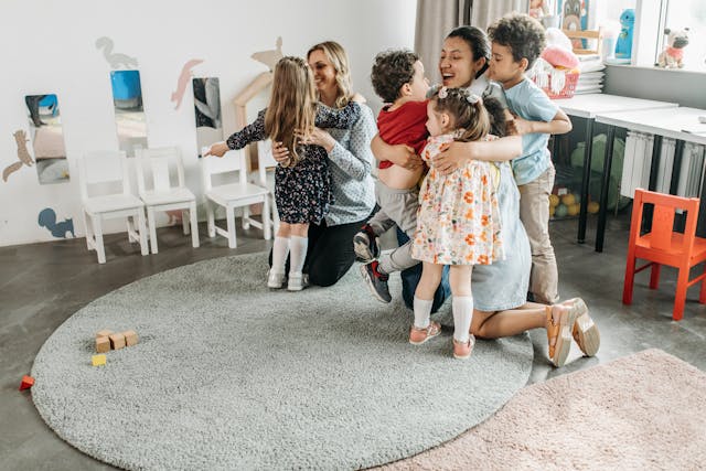 kids hugging teachers