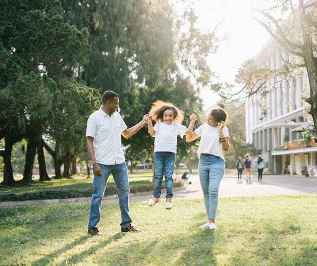 family having fun together in the grass