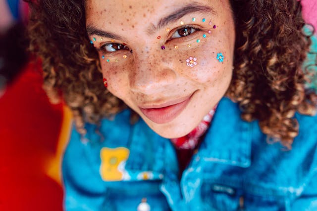 girl smiling with pain on face