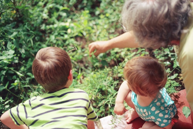 grandma with grandkids in garden