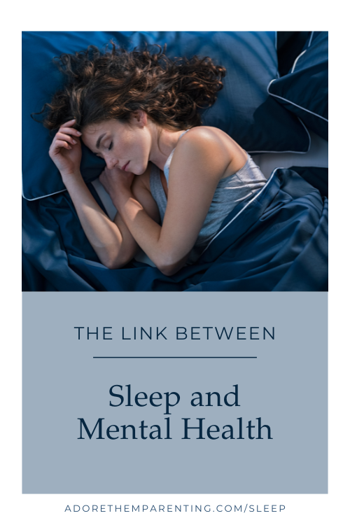 woman sleeping in navy colored bedding