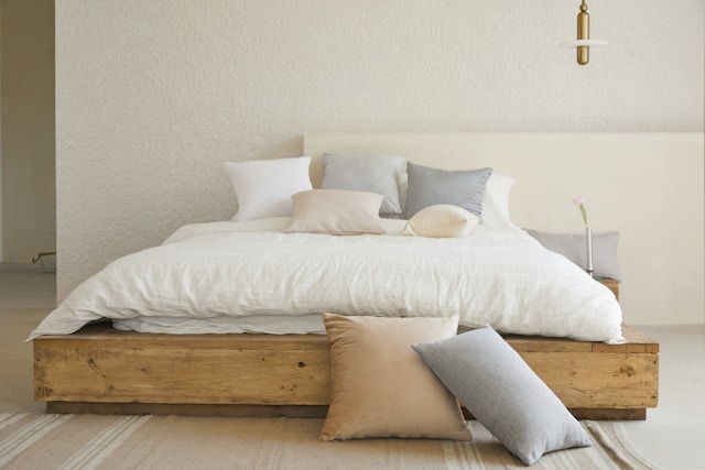 bed in white and light colored linens