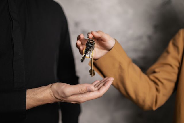 someone handing over house keys