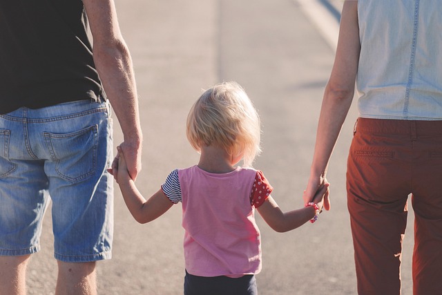 parents walking with daughter