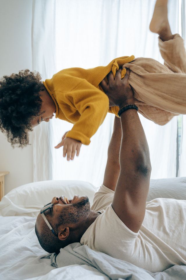 dad raising child up