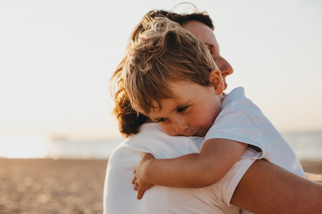 mom hugging son