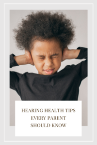 child covering ears