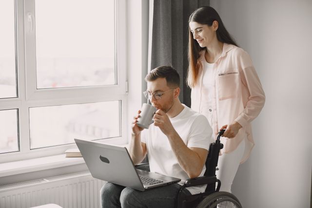 man in wheelchair with woman