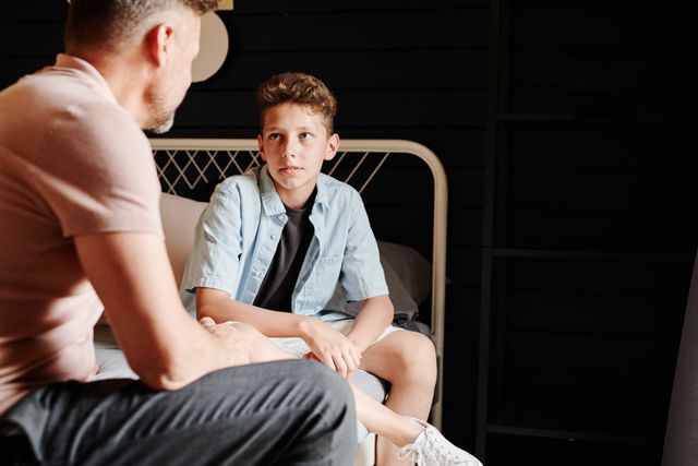 father talking to son