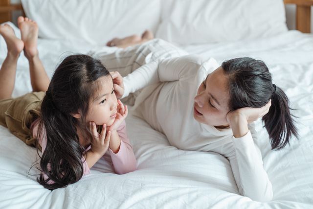 mother talking to daughter