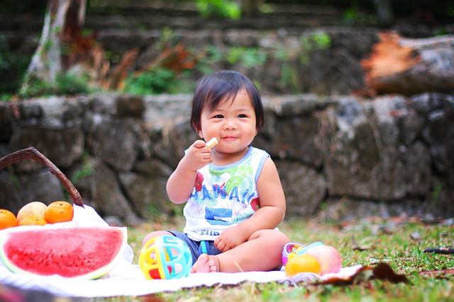 baby eating picnic outside