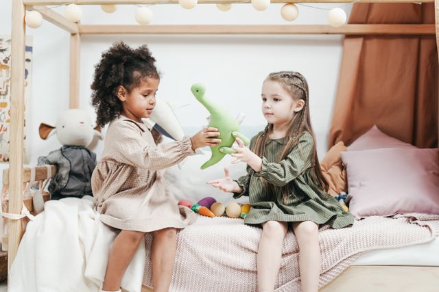 two girls playing with toys
