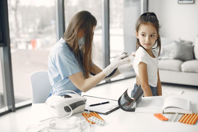 girl getting checked by dr at home