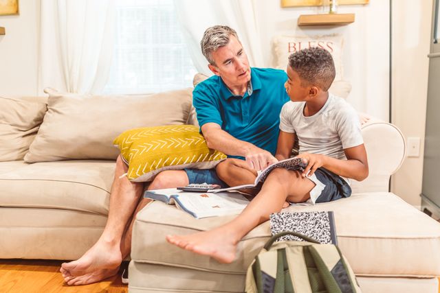 dad helping son to read