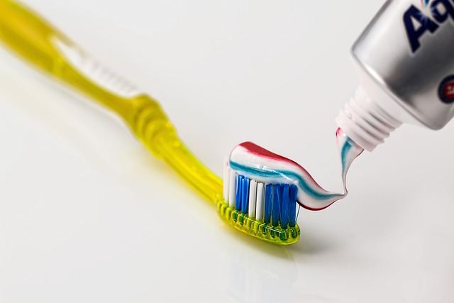 yellow toothbrush with toothpaste