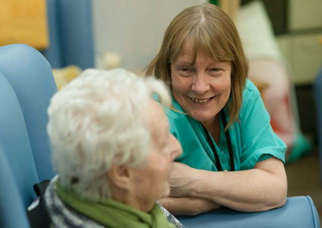 nurse talking to older woman