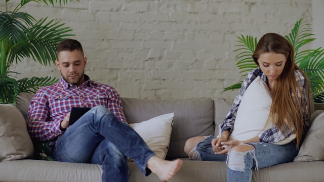 couple fighting on couch