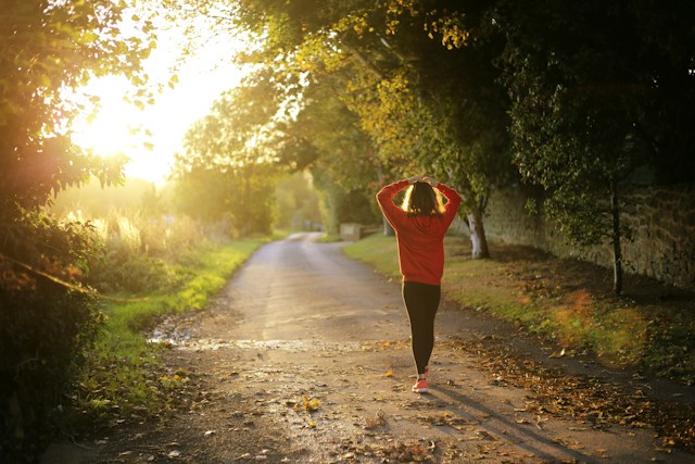 woman outside walking down lane