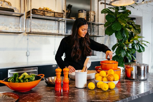 woman cooking healthy food in kitchen